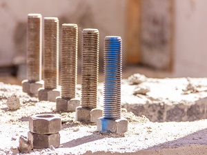 Large bolts and screws on a construction site that could be considered an impalement hazard.