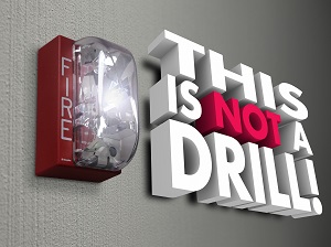 Fire Alarm with Graphic Words that say, "This is not a Drill!"