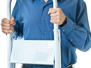 A person holding and carrying a step ladder.