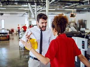 A supervisor yelling at a worker.