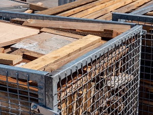 Larger Containers to Collect Lumber Scraps on Construction Site