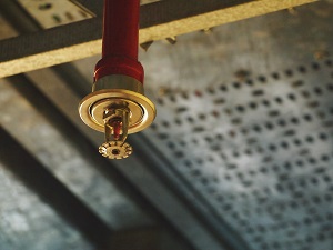 Sprinkler Head on Industrial Sprinkler System Inside Large Facility
