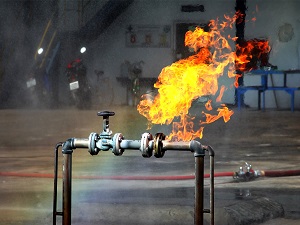 Gas Fire Coming From Pipe in Industrial Building