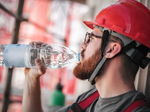 Worker Drinking Bottled Water