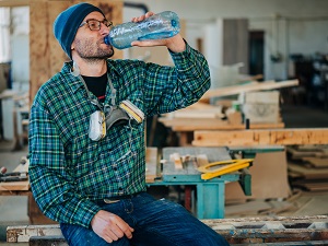 Worker Drinking Bottled Water