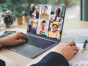Videoconferencing with Employees on Laptop