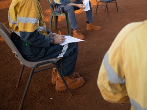 Construction workers having a safety meeting.