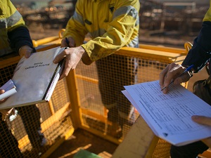 Construction workers reviewing the emergency action plan.