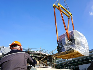 Crane Lifting Load Near Construction Area