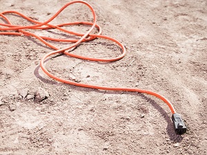 Extension Cord Laying in the Dirt