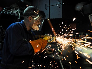 Welder Wearing Face Shield, Sparks Flying