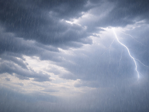 Thunderstorm clouds with heavy rain and lightning during a storm event.