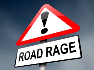 A mock-up of a road sign has an exclamation point and says road rage to indicate that road rage is dangerous.