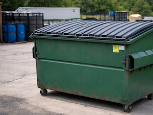 Closed dumpster at an industrial site used to prevent stormwater contamination.