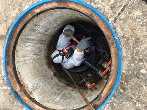 A worker in a confined space.