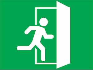 Green emergency exit symbol showing a white figure running through an open doorway.