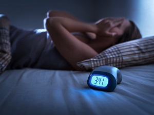 Woman in Bed with Insomnia