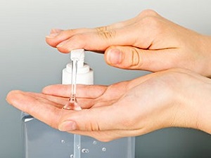 Hands Pumping Out Hand Sanitizer
