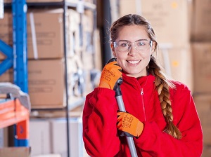 Happy Warehouse Worker Wearing Safety Glasses and Gloves