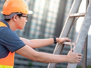 Construction Worker Climbing Step Ladder