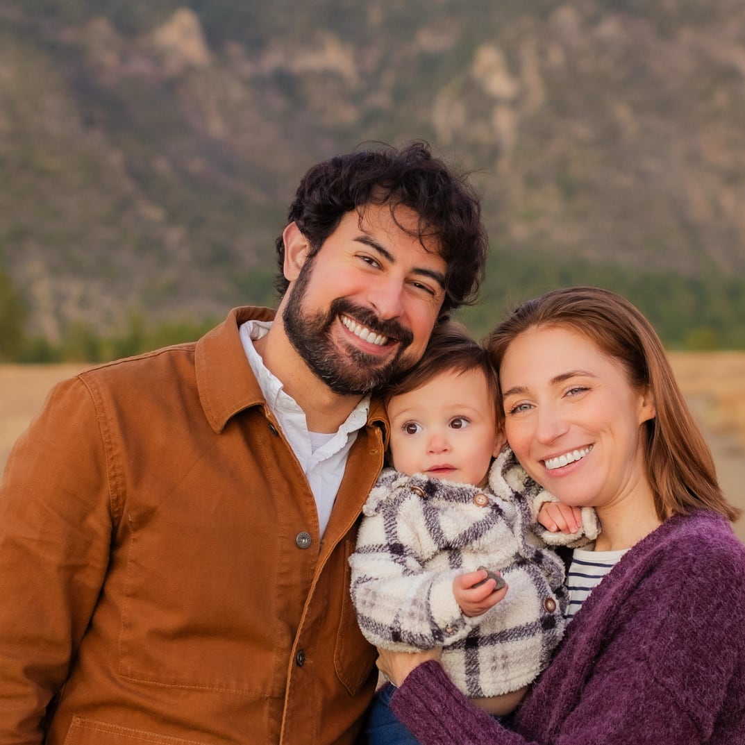 A portrait of me and my wife and daughter