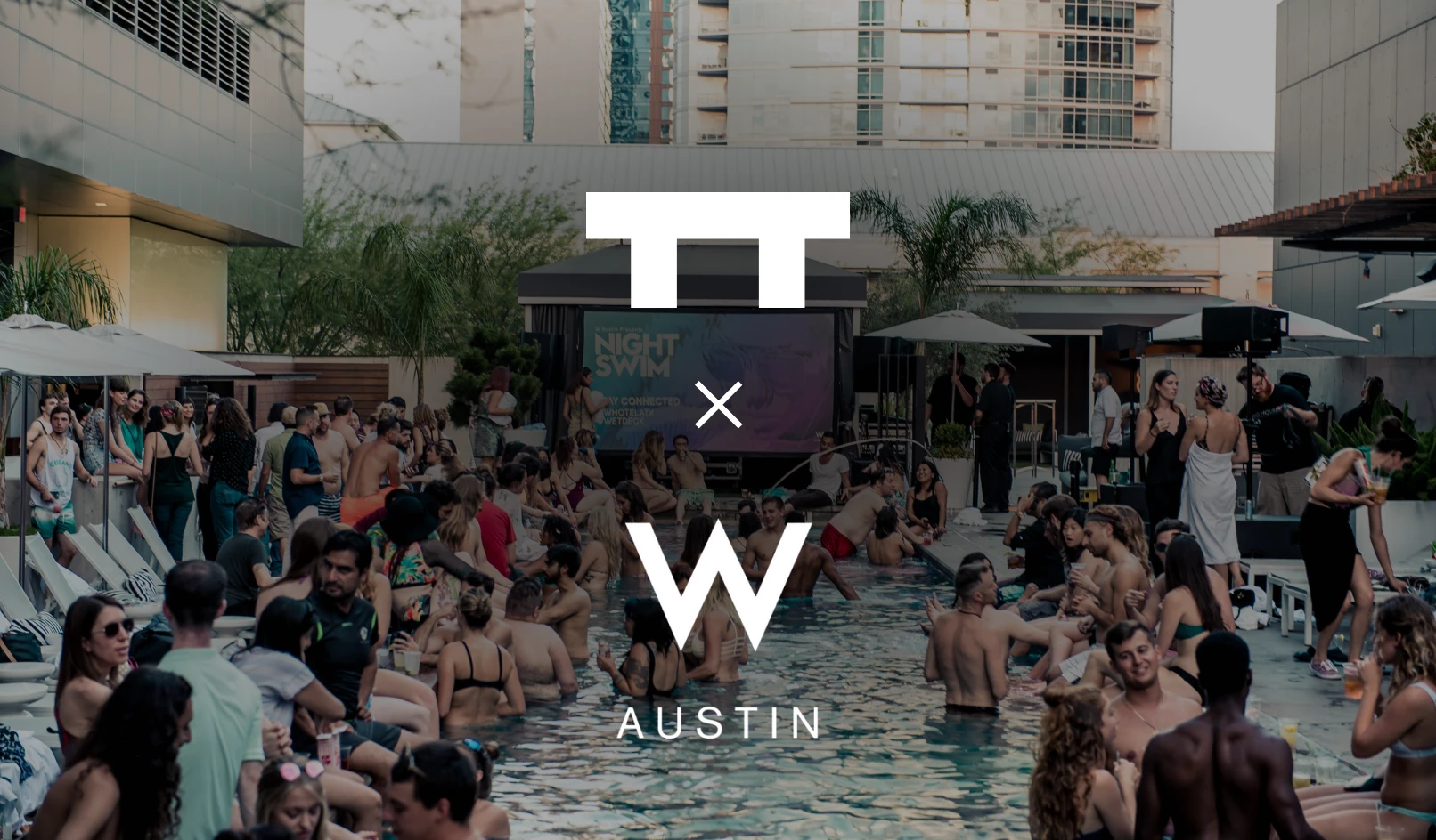 Crowded outdoor pool party at W Austin hotel with people socializing in and around the pool.