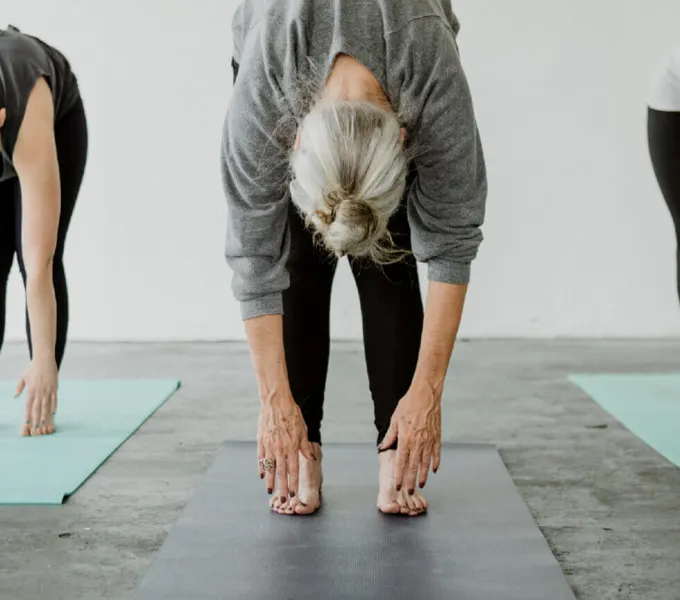 Mature woman stretching.