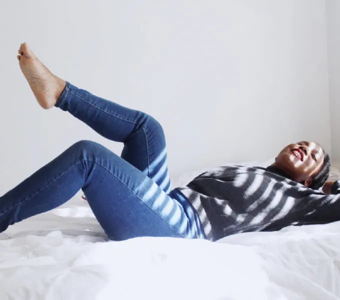 Woman lying in bed.