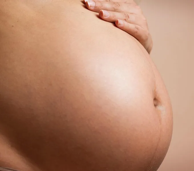 Mother's pregnant belly.