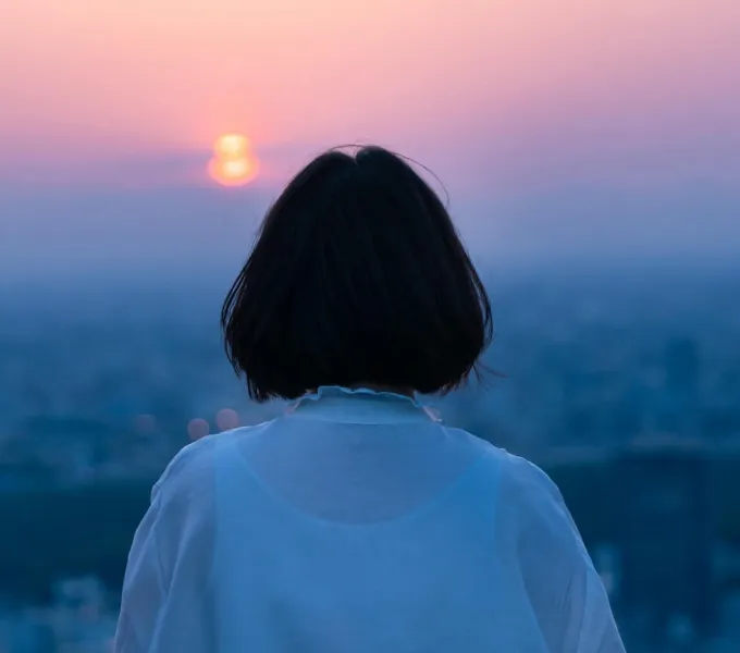 Woman looking into distance.