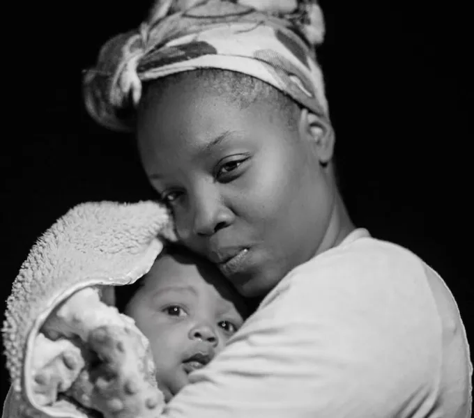 Black mother with baby.