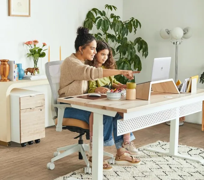 Mother and daughter with computer.