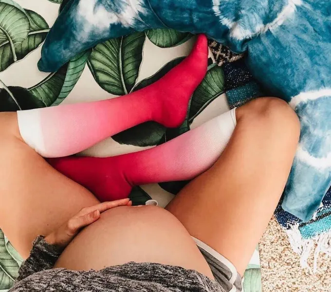 Pregnant woman in compression socks.