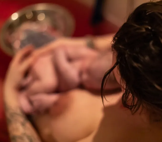 A woman with a newborn baby.