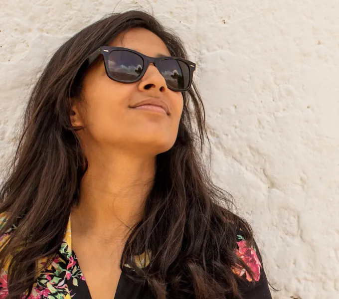 A woman wearing sunglasses.