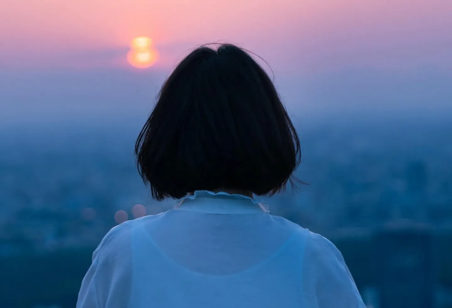 Woman looking into distance.