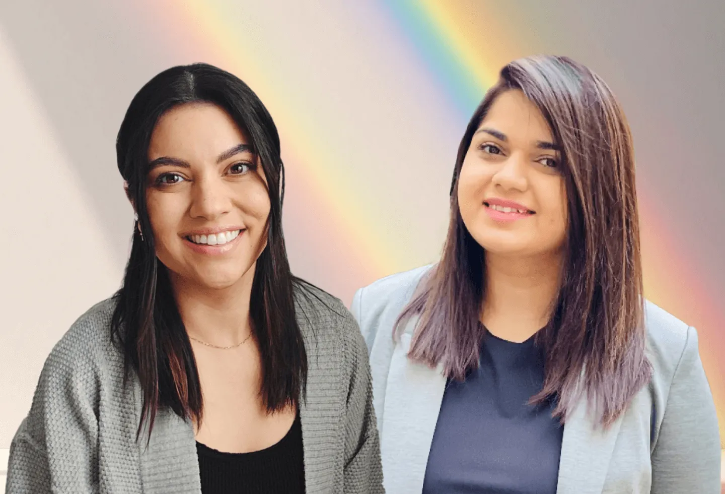 Origin Physical Therapists Dr. Vanessa Amezquita, PT, DPT and Dr. Paaneri Jethwa, PT, DPT with a rainbow in the background in celebration of Pride 2025.