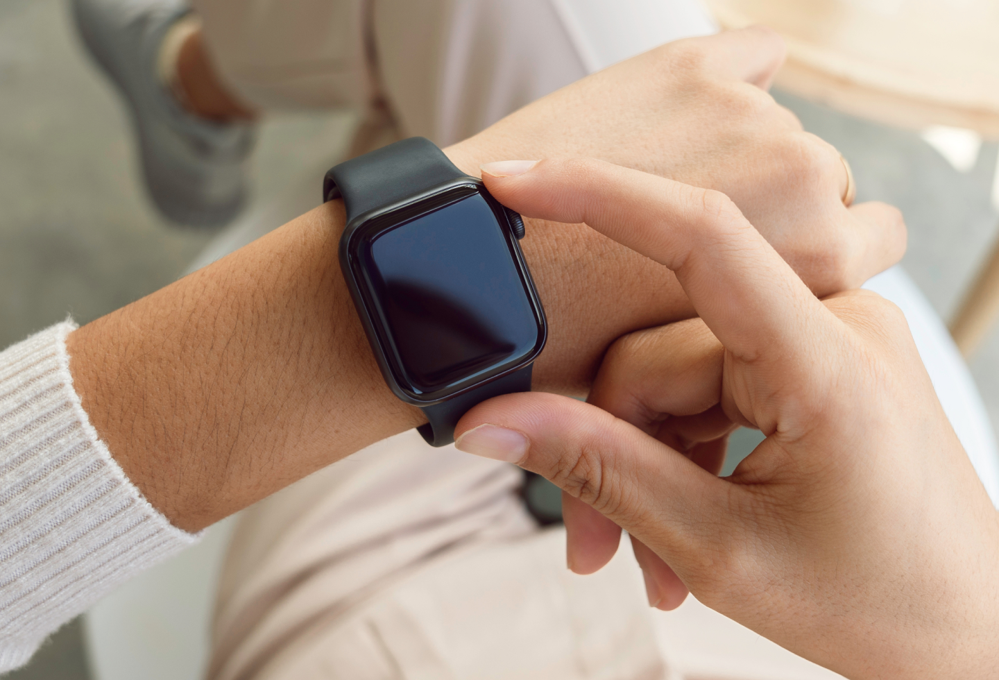 Person wearing an Apple Watch wearable, representing How to Use Health Trackers for Pelvic Health