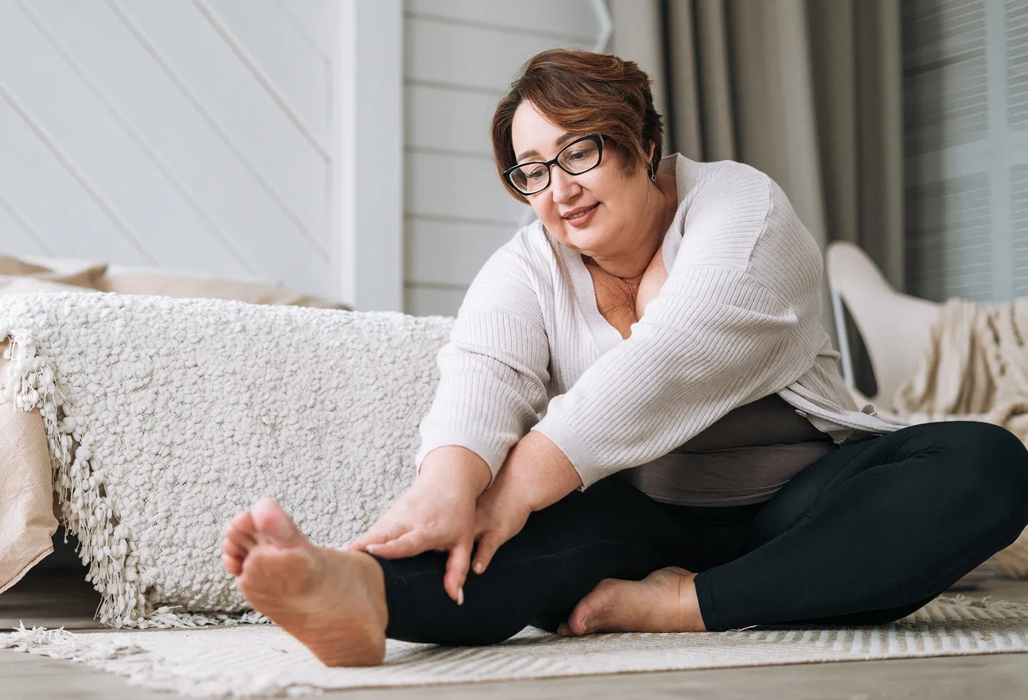 Mature woman doing exercises for her pelvic floor physical therapy appointment.