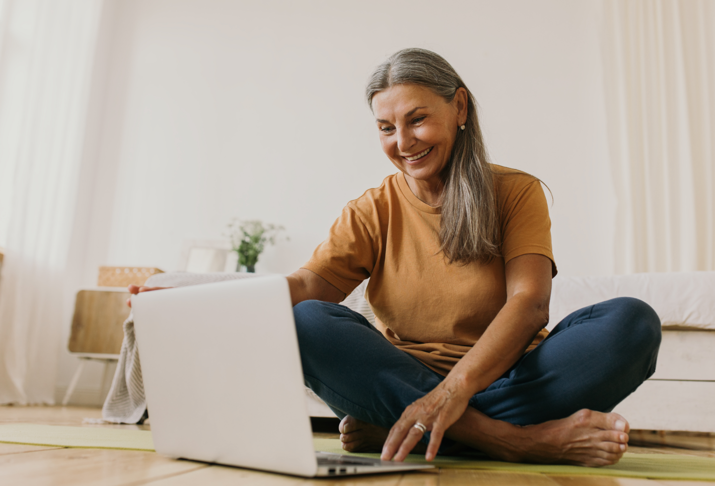 Woman doing a virtual pelvic floor check-up at Origin physical therapy