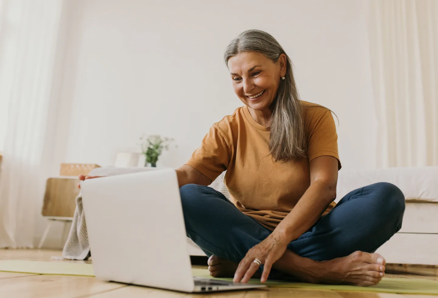 Woman doing a virtual pelvic floor check-up at Origin physical therapy.
