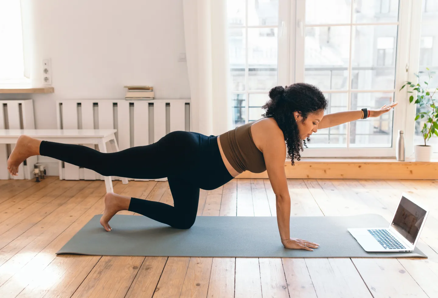 Woman exercising during pregnancy.
