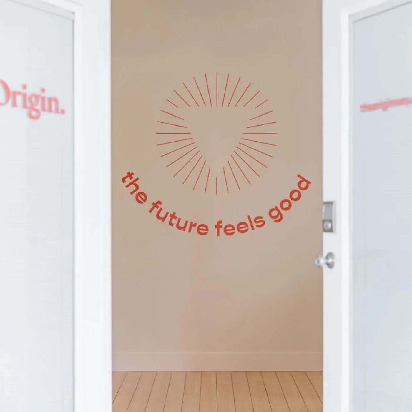 Uplifting wall art featuring the words “the future feels good” at Miami clinic.