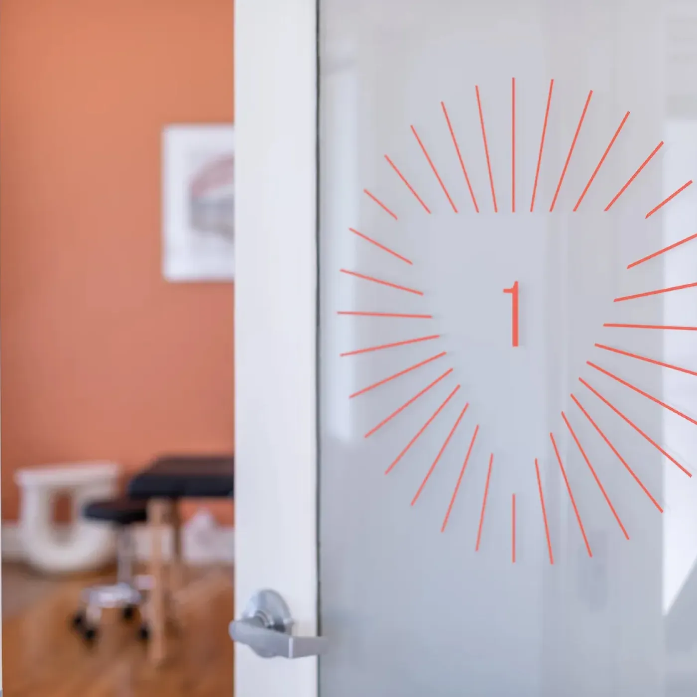 A door opening into a treatment room at Origin’s spa-like Berkeley clinic.