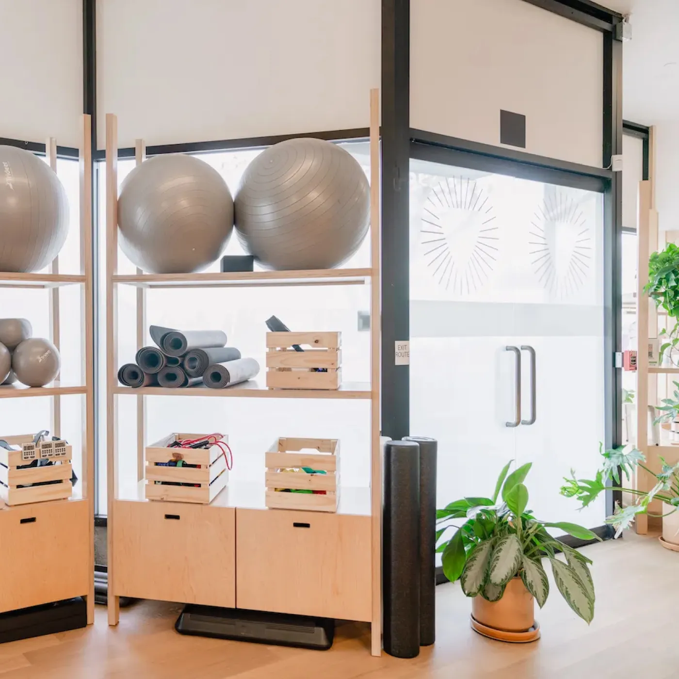 Bright, colorful gear and cheerful plants at Origin’s Brentwood clinic.