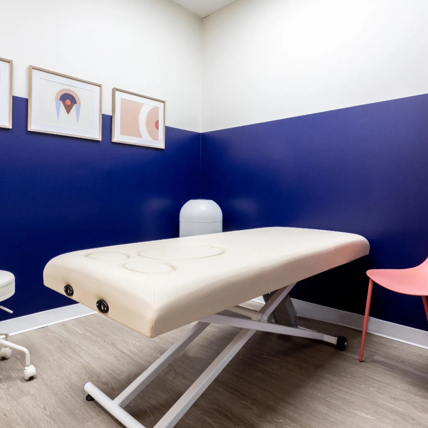 The brightly lit, cheerful clinic room at Origin.