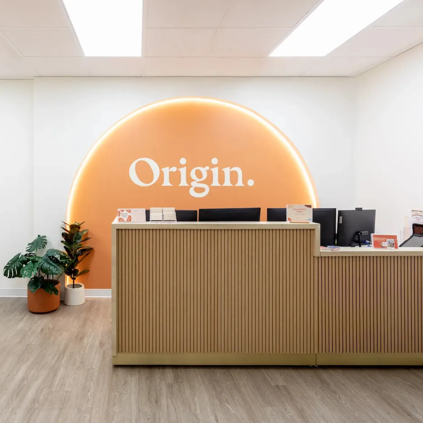 The cheerful and spa-like front desk at Origin’s West Loop clinic.