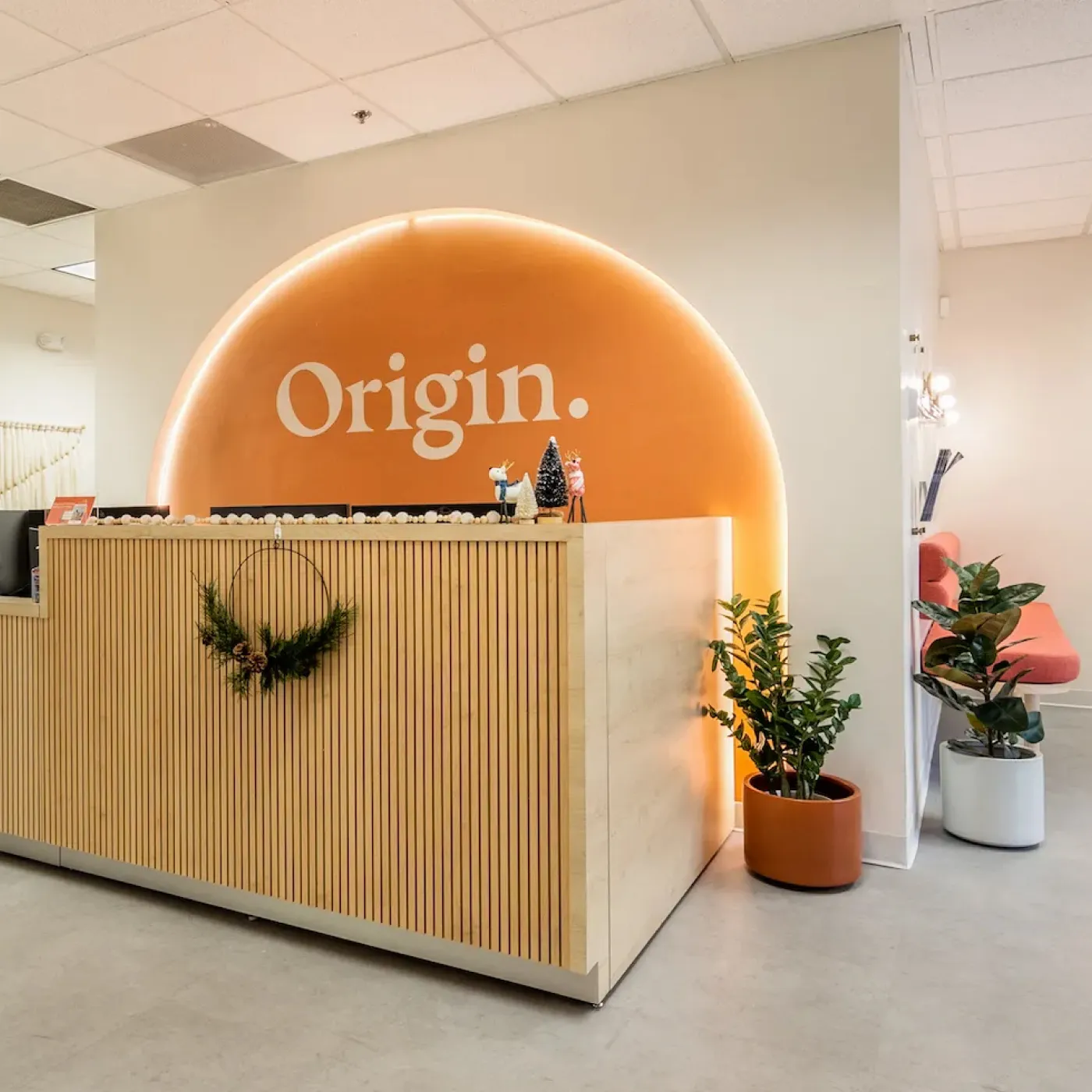One of the brightly lit, cheerful front desks at Origin.