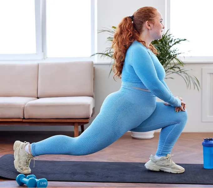 Woman doing stretching exercises for tight pelvic muscles.