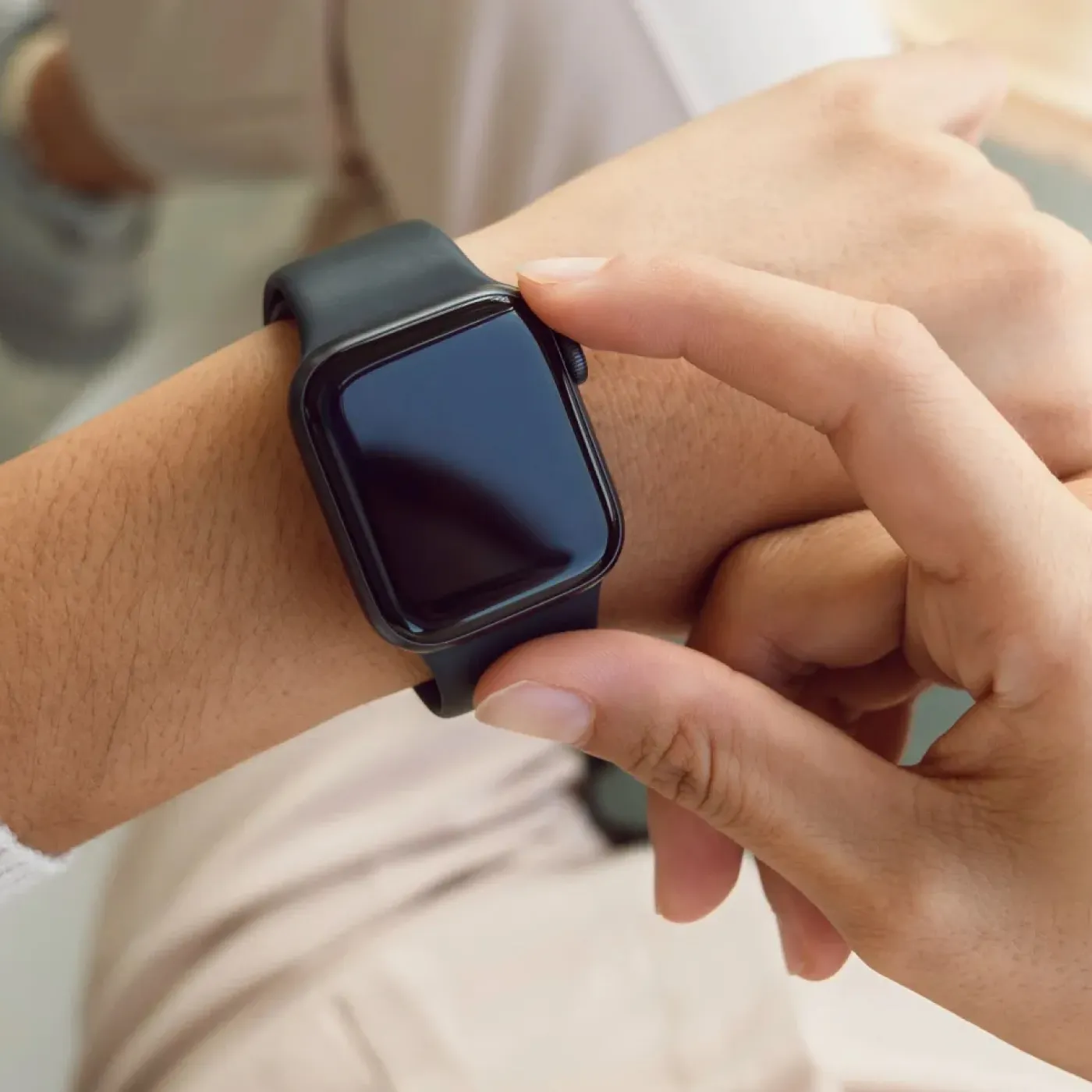 Person wearing an Apple Watch wearable, representing How to Use Health Trackers for Pelvic Health.